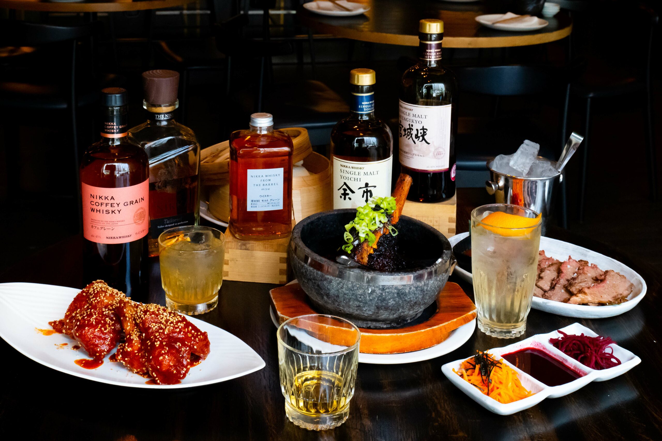 Japanese whiskey selection and food pairings, including fried chicken and beef.